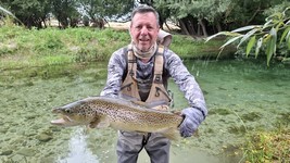 Fly fishing trout in beautiful New Zealand