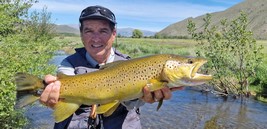 Fly fishing trout in beautiful New Zealand